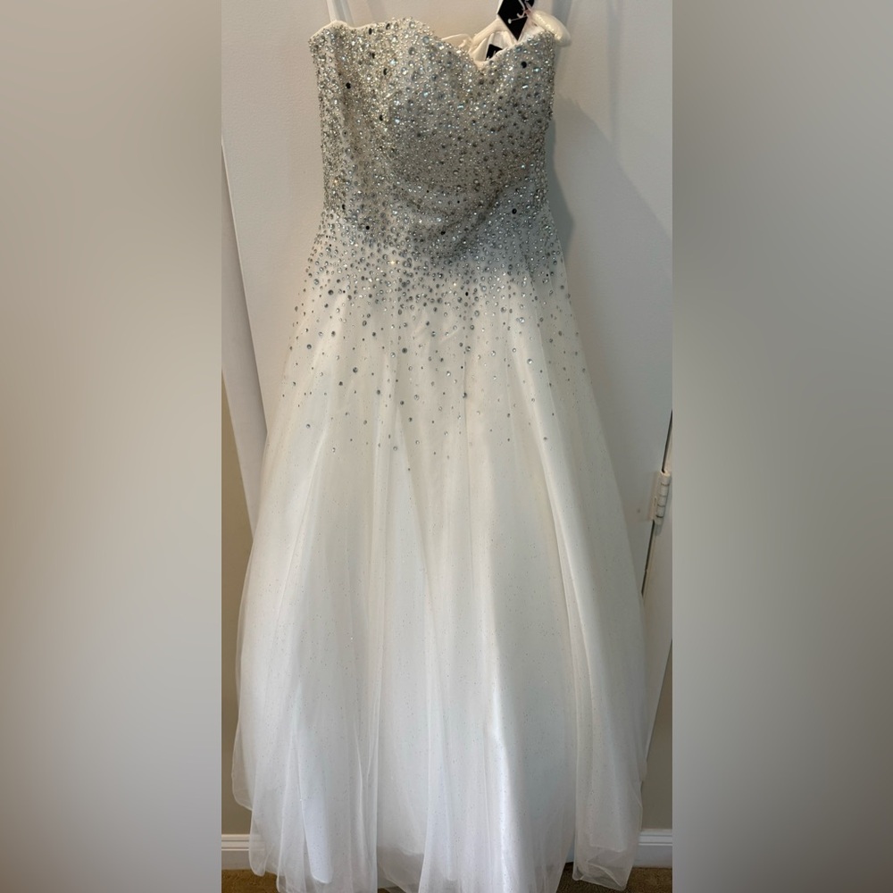 Brand New With Tags Jovani white dress with rhinestones in a size 2.